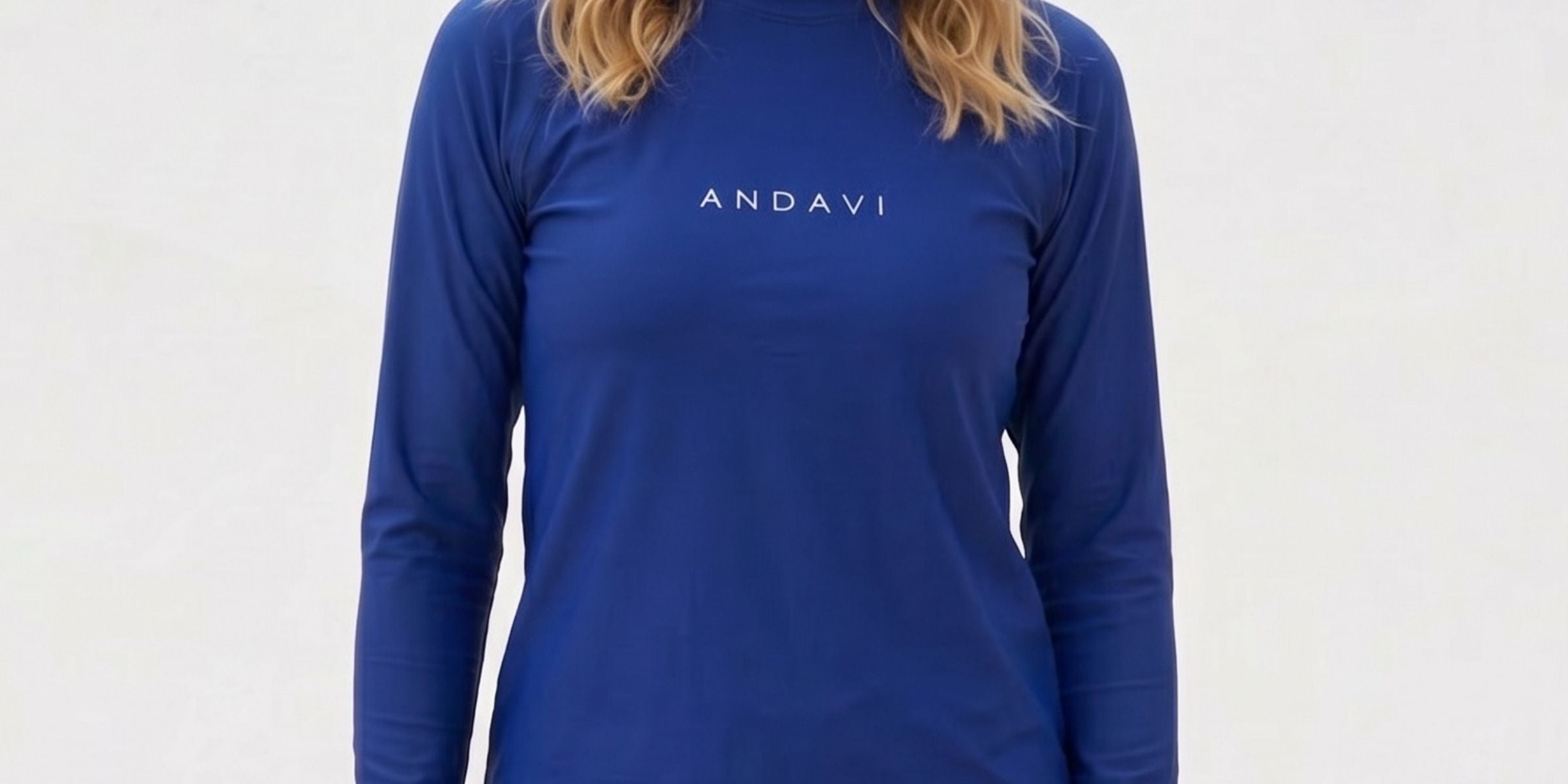 women wearing andavi dark blue rash guard and andavi white andblue print swim shorts against a white background