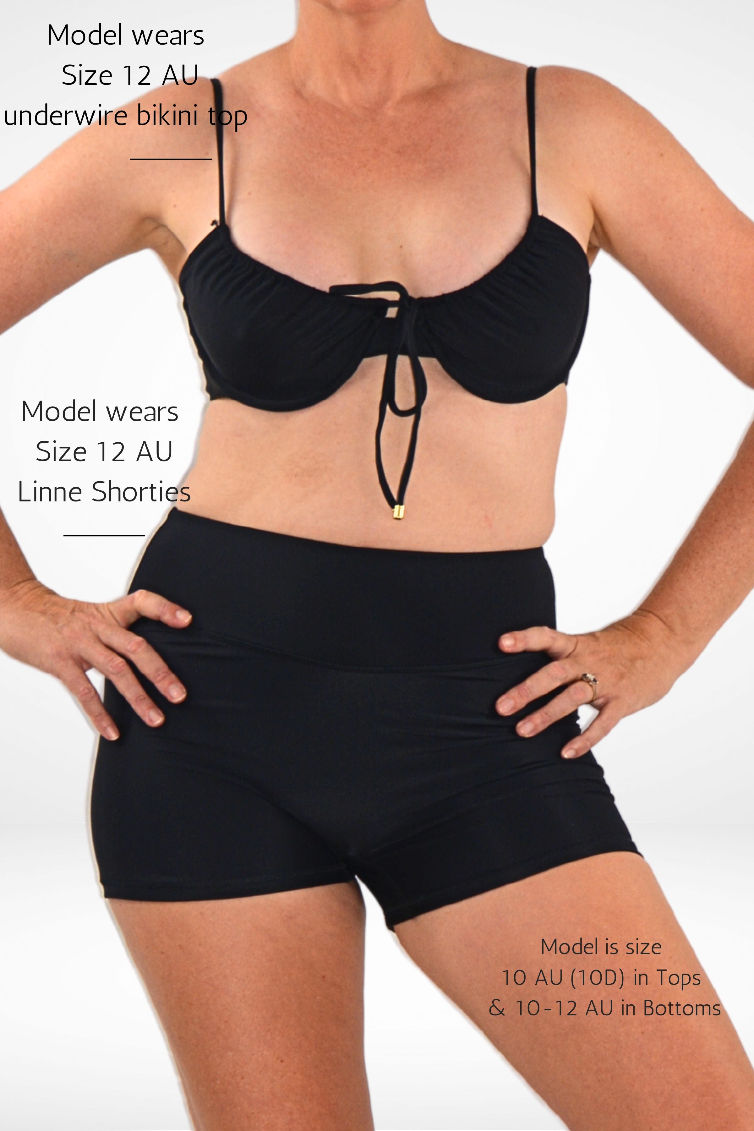 women wearing andavi black underwire bikini top and swim shorts bundle