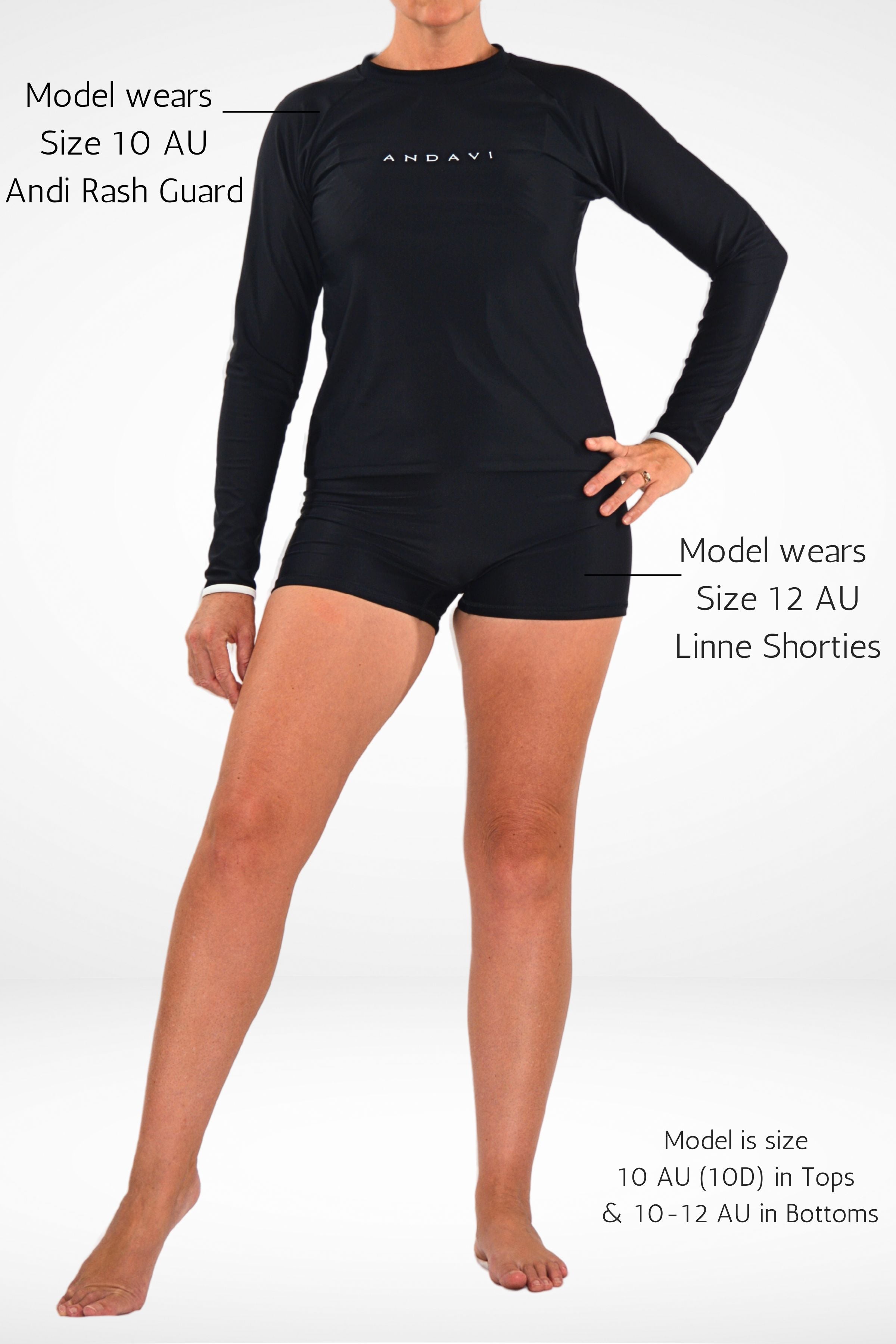 women wearing black andavi swim loose fit rah guard and black matching swim shorties