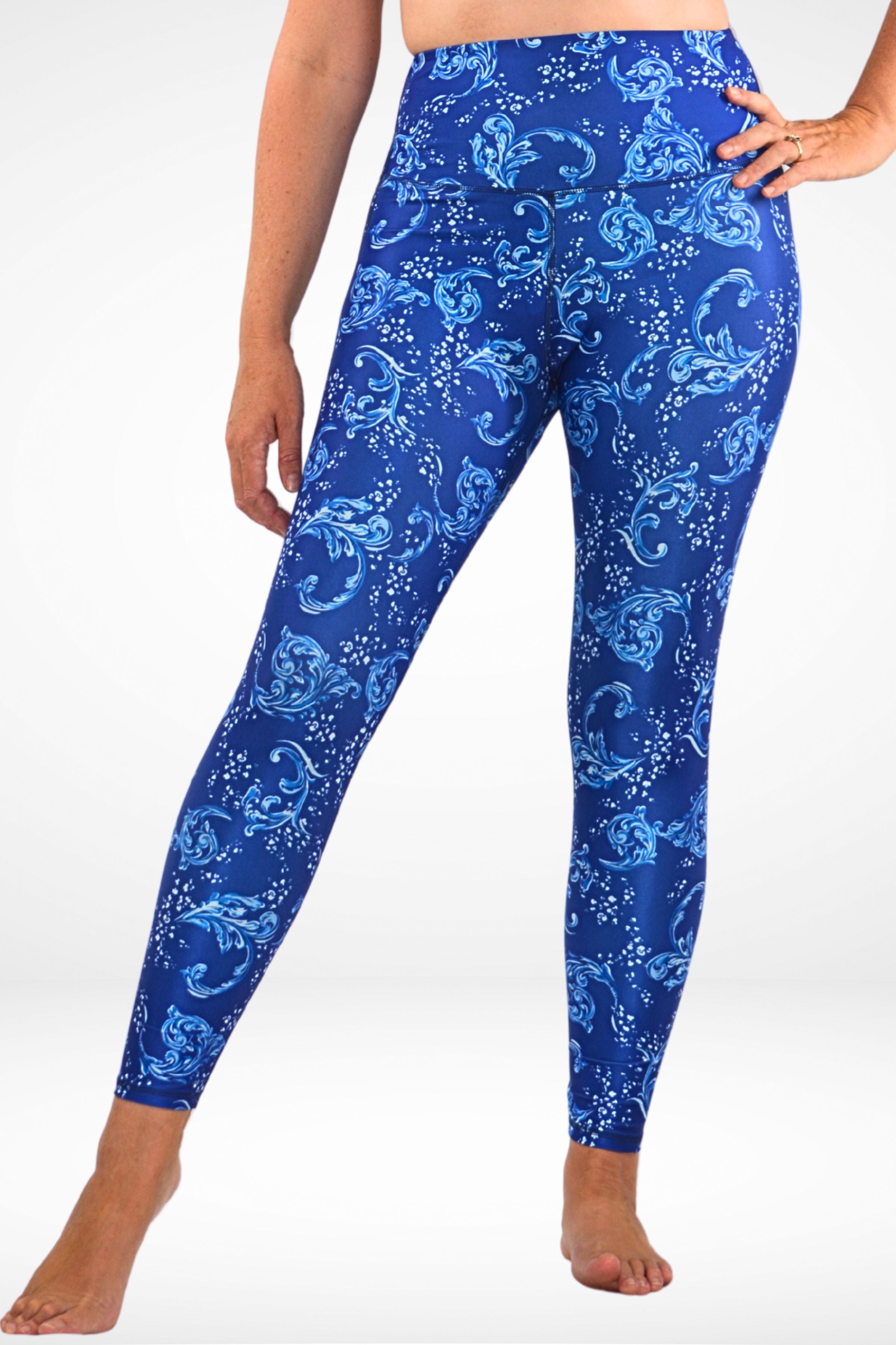 women wearing andavi swim blue and white print swim legging and navy blue triangle bikini top