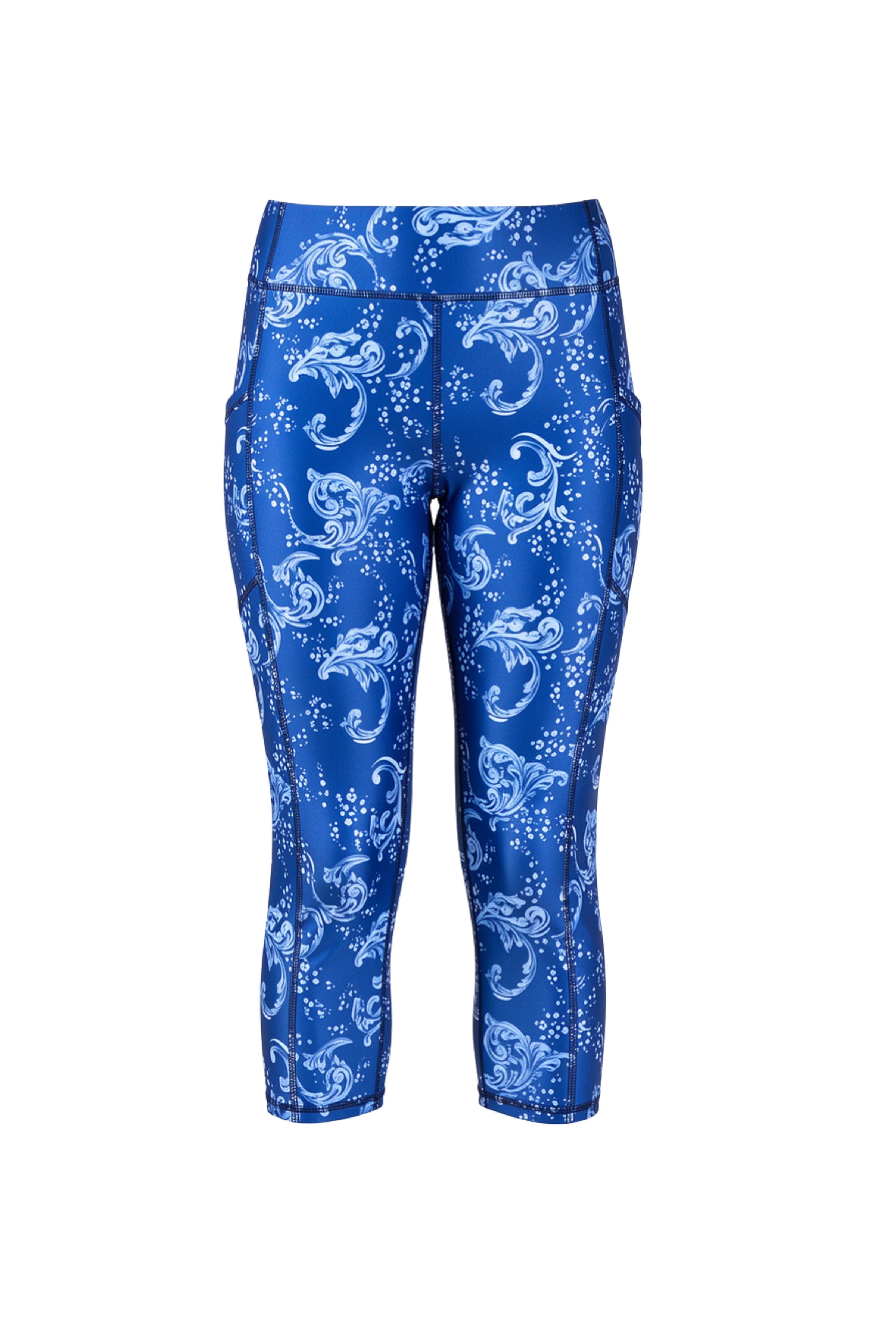 Blue capri pants with white floral pattern on a white background