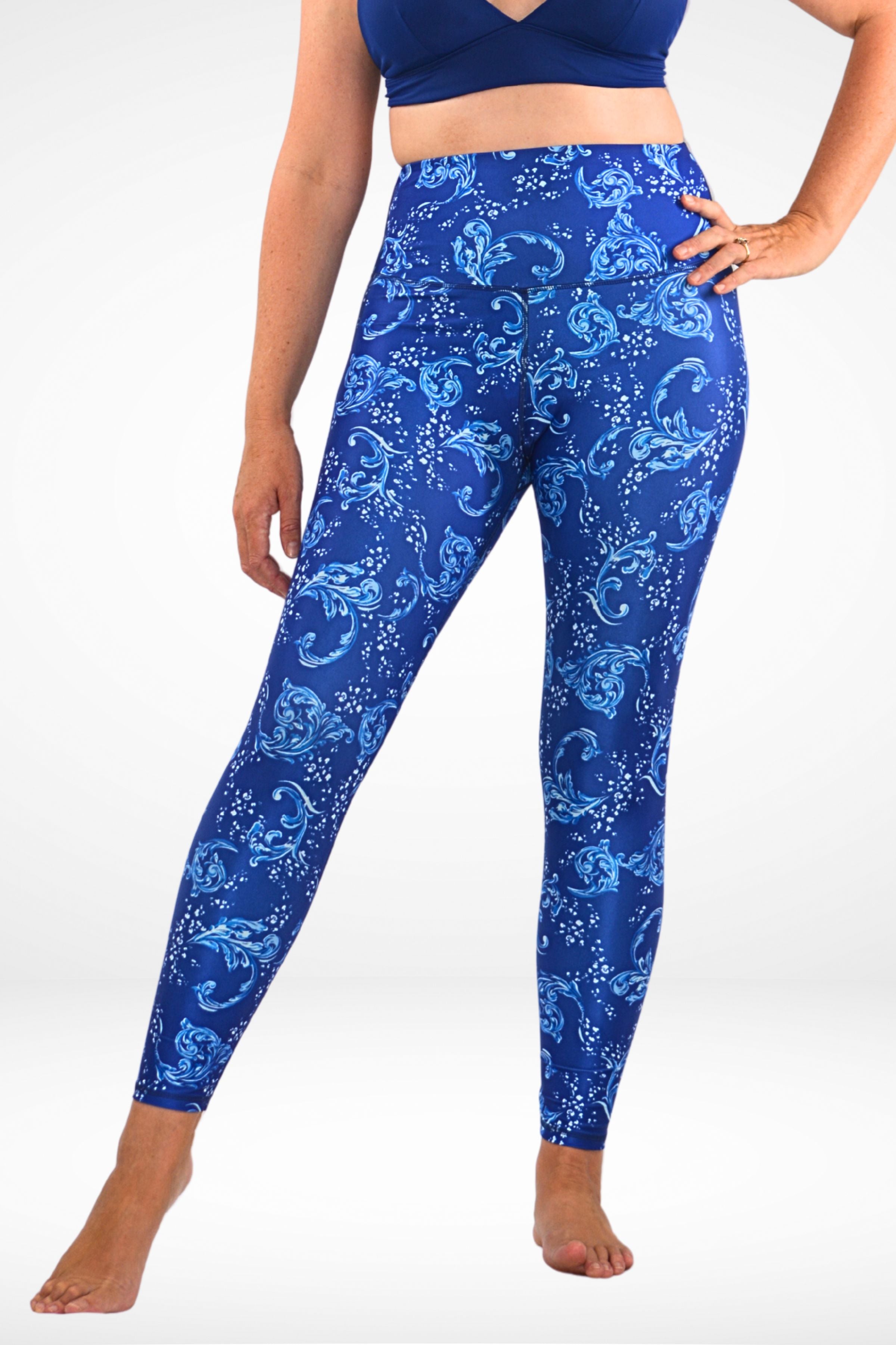 women wearing andavi swim blue and white print swim legging and navy blue triangle bikini top