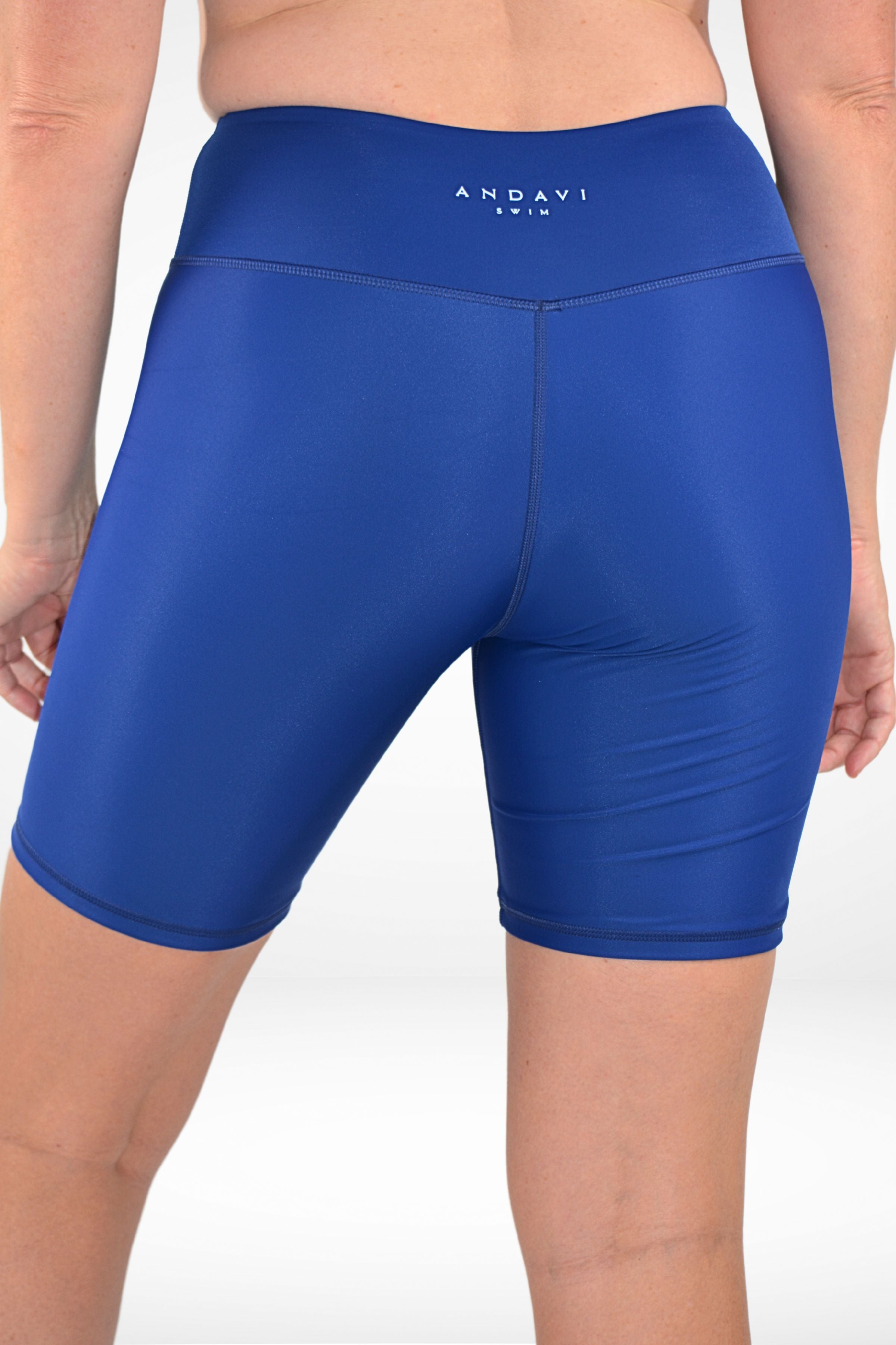 model wearing andavi swim navy blue long line swim shorts
