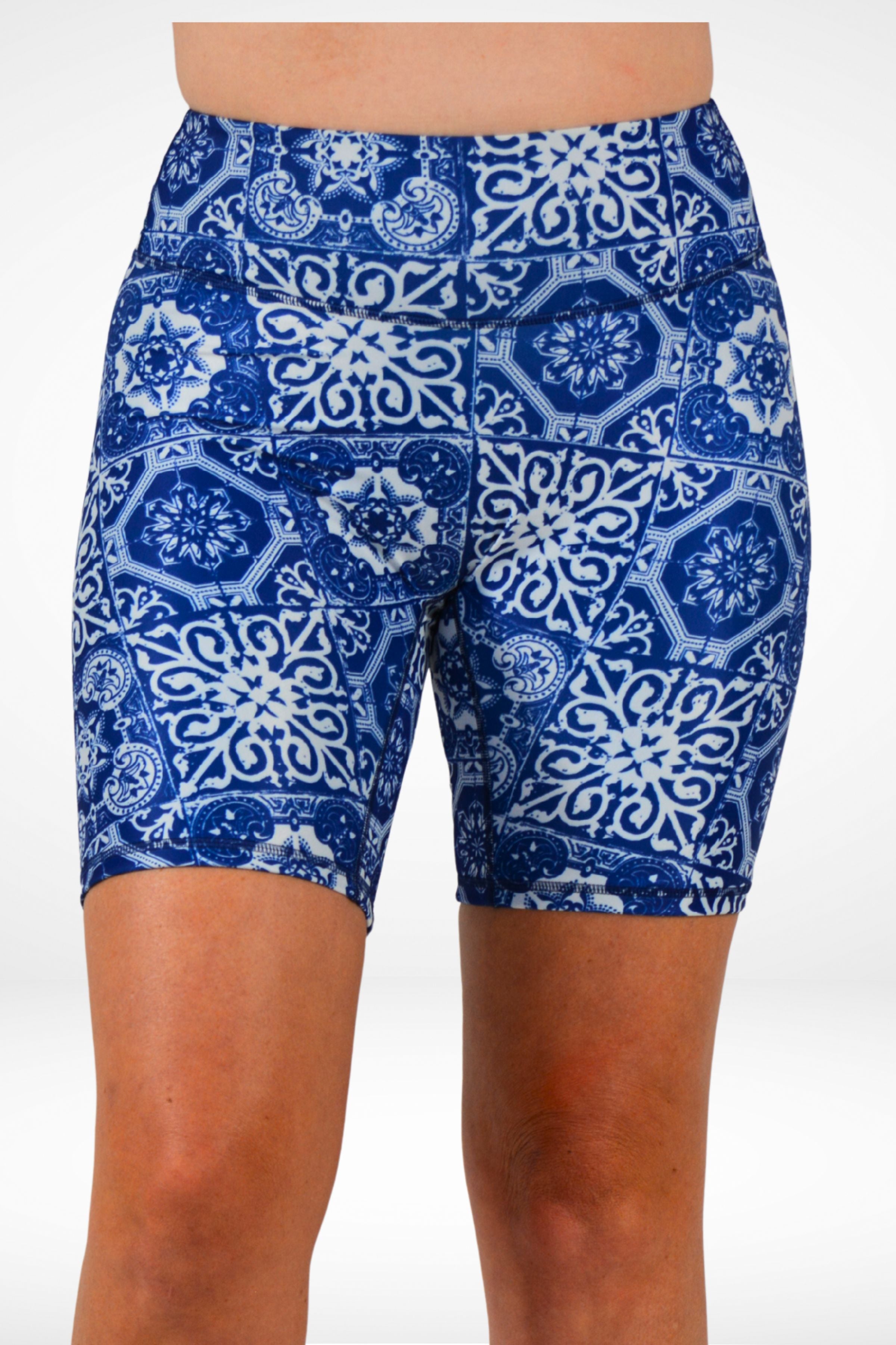 Blue and white patterned shorts on a white background