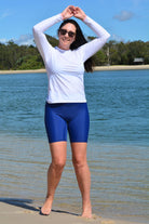 model wearing andavi swim navy blue long line swim shorts