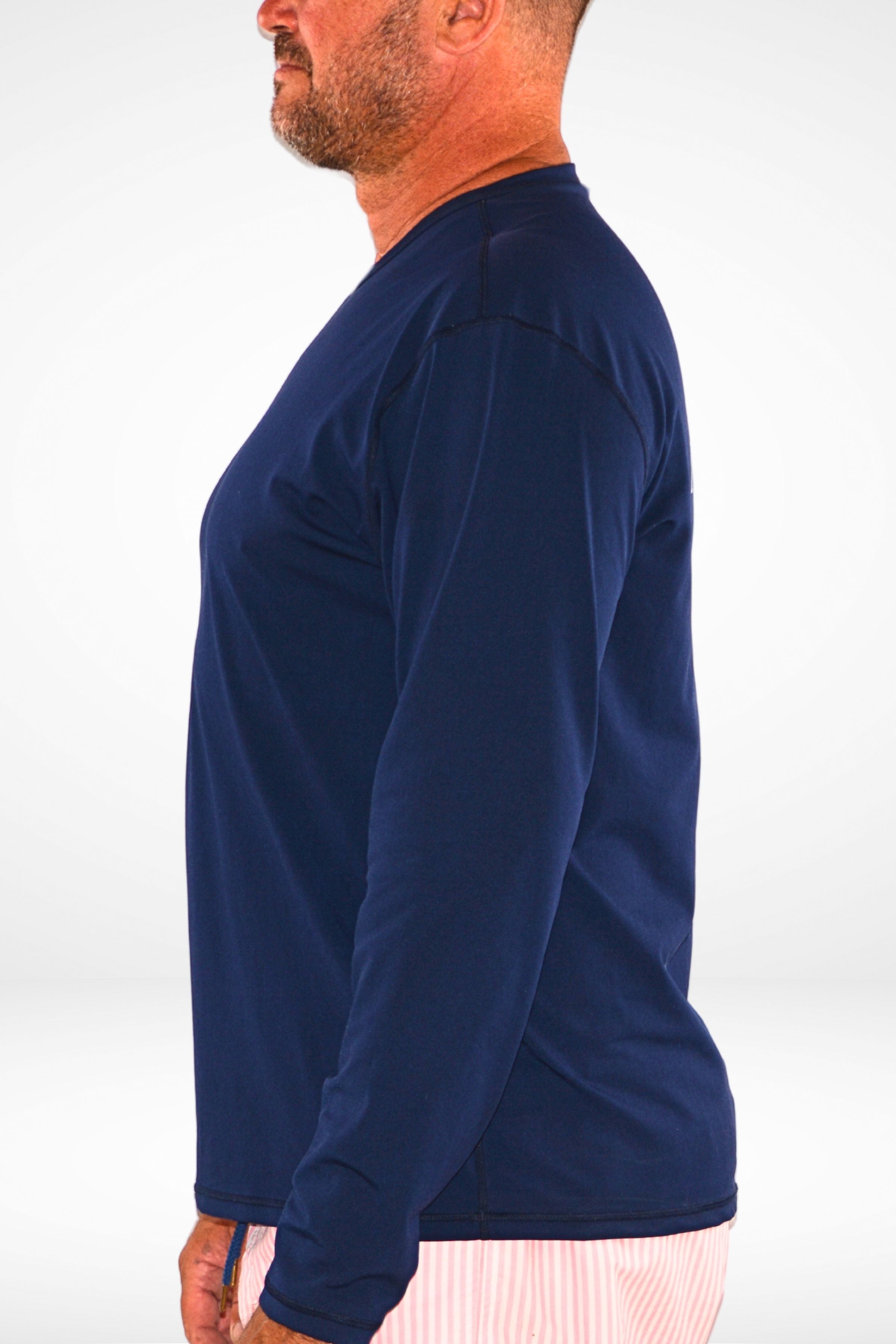 man wearing andavi long sleeve navy blue rash guard
