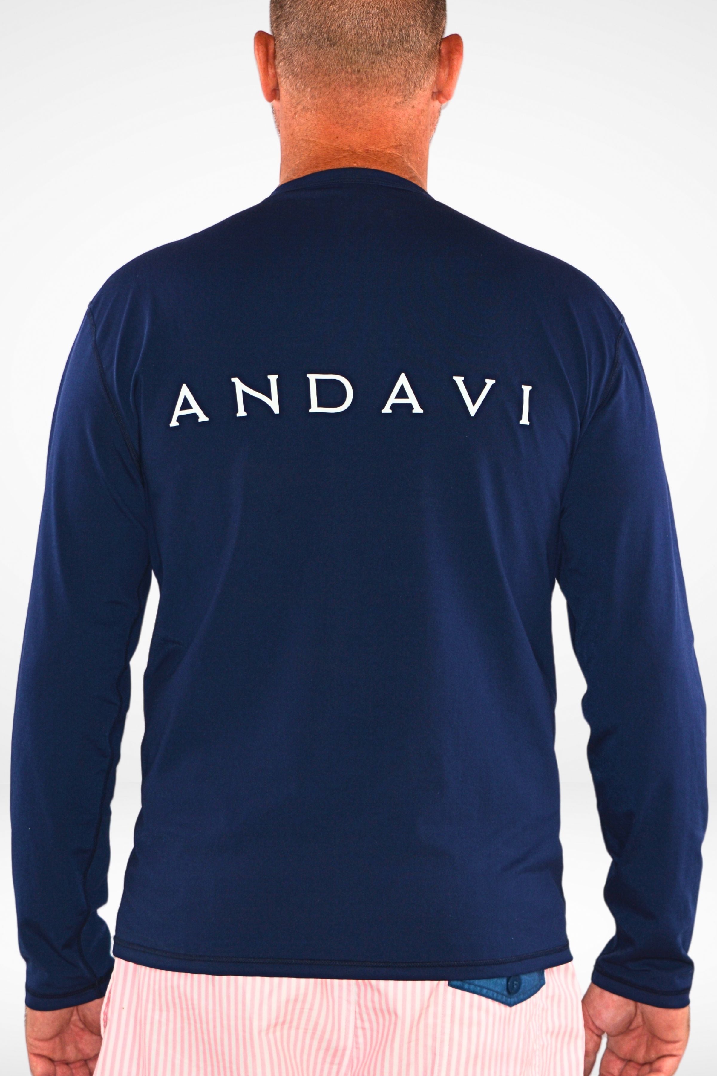 man wearing andavi long sleeve navy blue rash guard