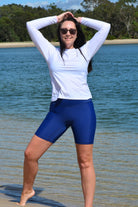 model wearing andavi swim navy blue long line swim shorts