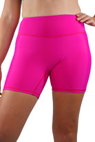 model wearing andavi swim hot pink swim shorts
