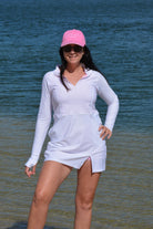 women at the beach wearing andavi swim pink cap and andavi swim long sleeve white swim active dress cover up