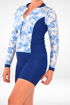 women wearing navy blue and white rash guard with matching navy blue swim shorts