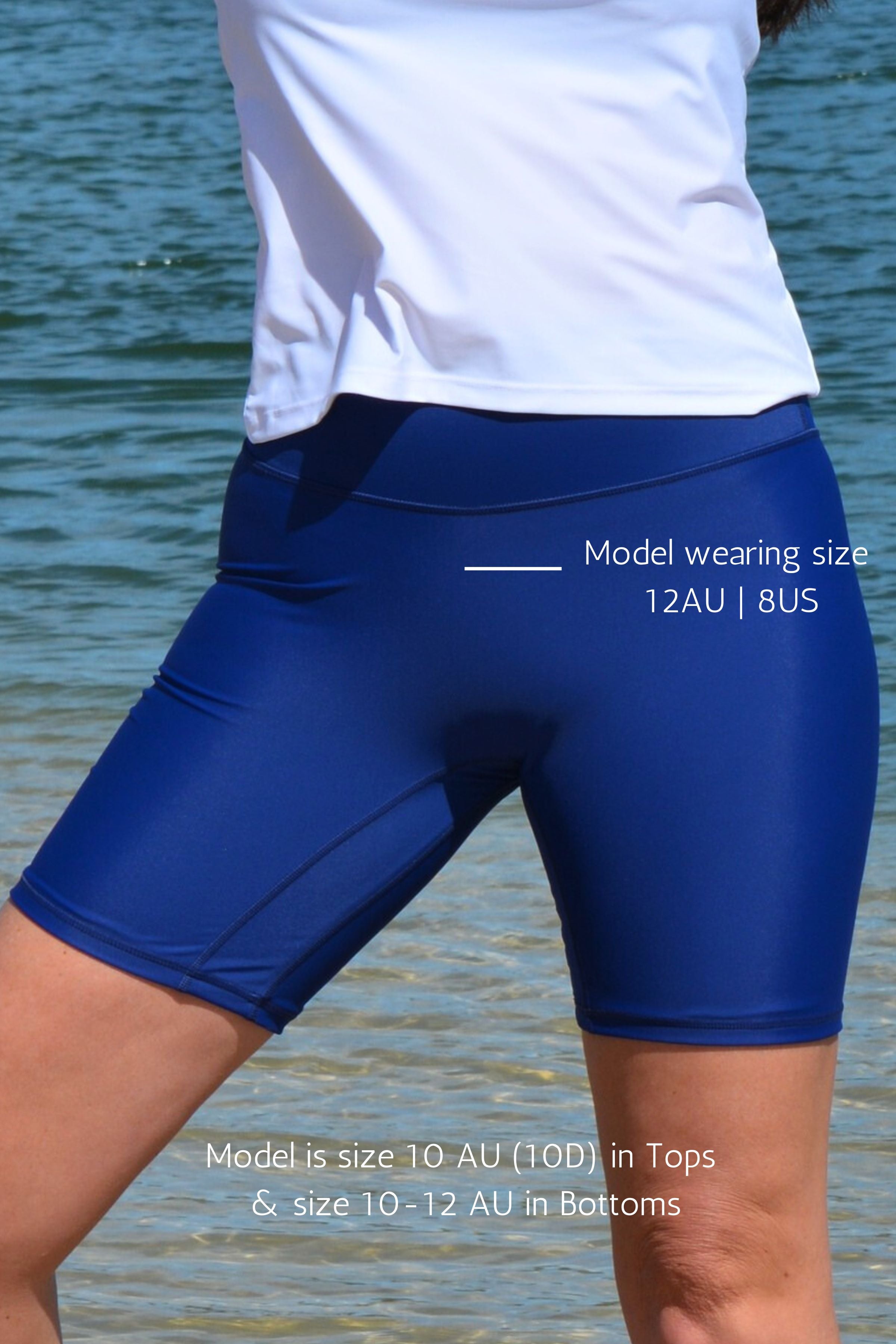 model wearing andavi swim navy blue long line swim shorts