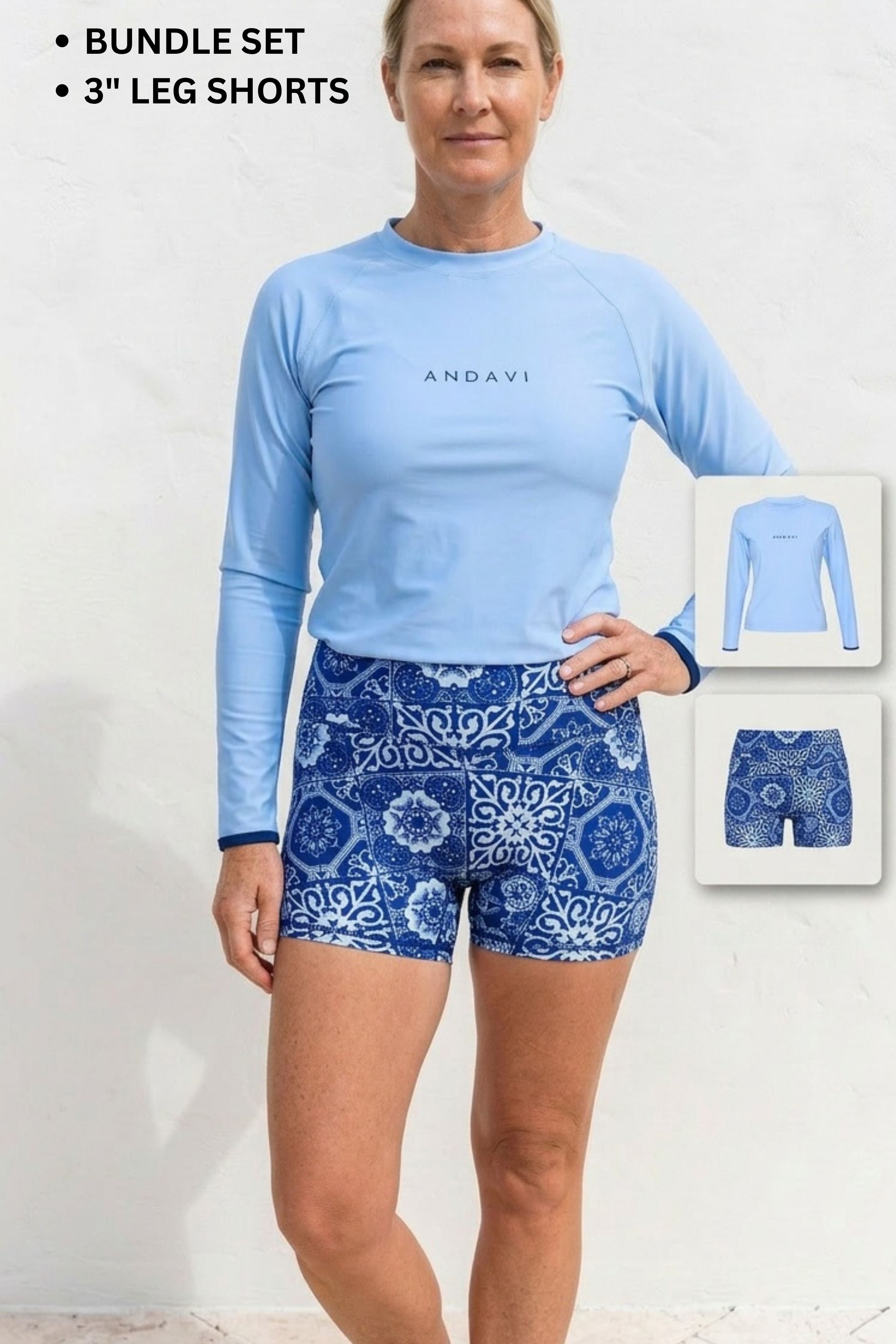 Woman wearing a blue long-sleeve top and patterned shorts with Andavi branding, on a white background.