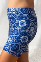 Blue and white patterned shorts on a plain background