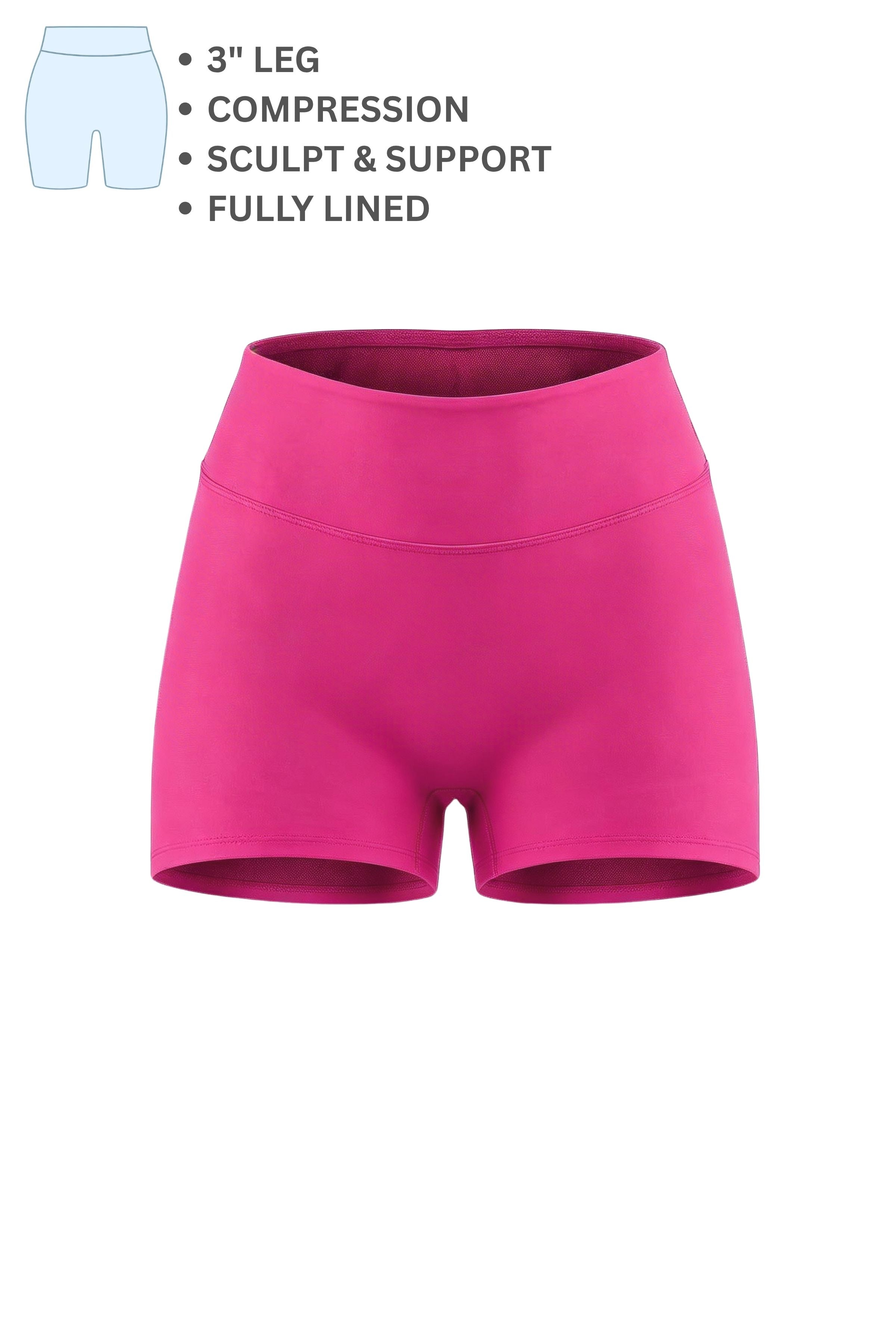 Pink compression shorts with text detailing features on a white background