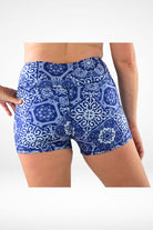 model wearing geometric white blue print andavi swim shorties 