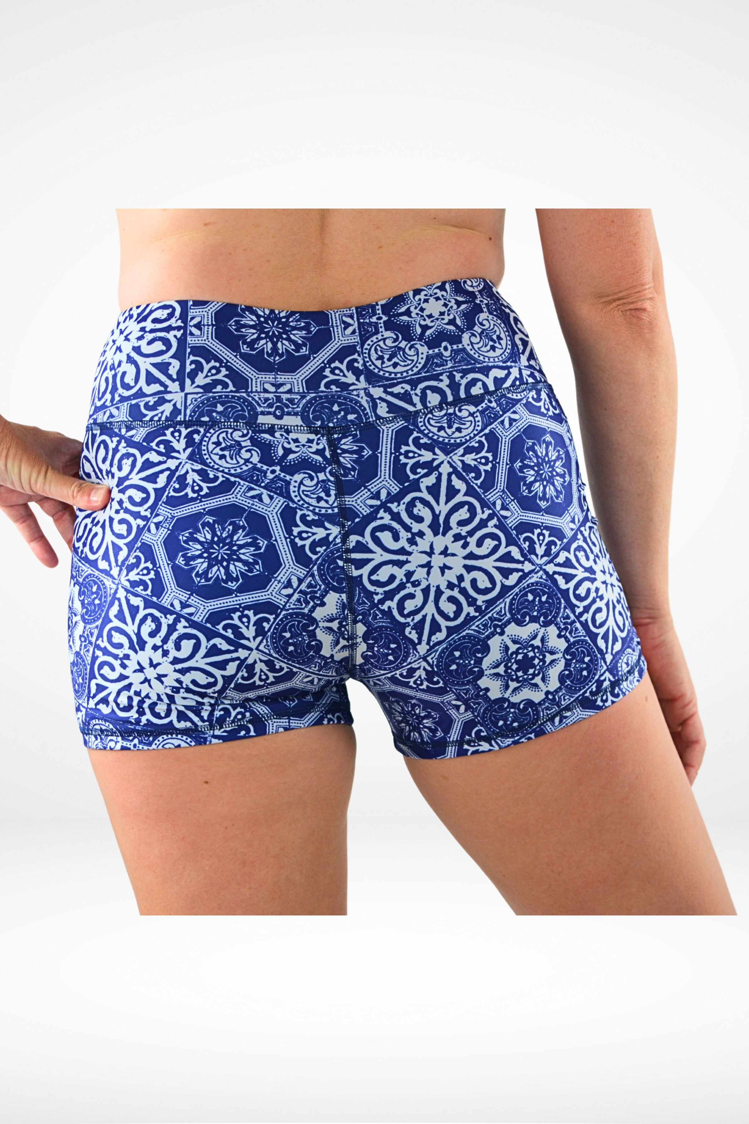model wearing geometric white blue print andavi swim shorties 