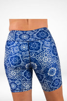 Blue and white patterned shorts on a white background