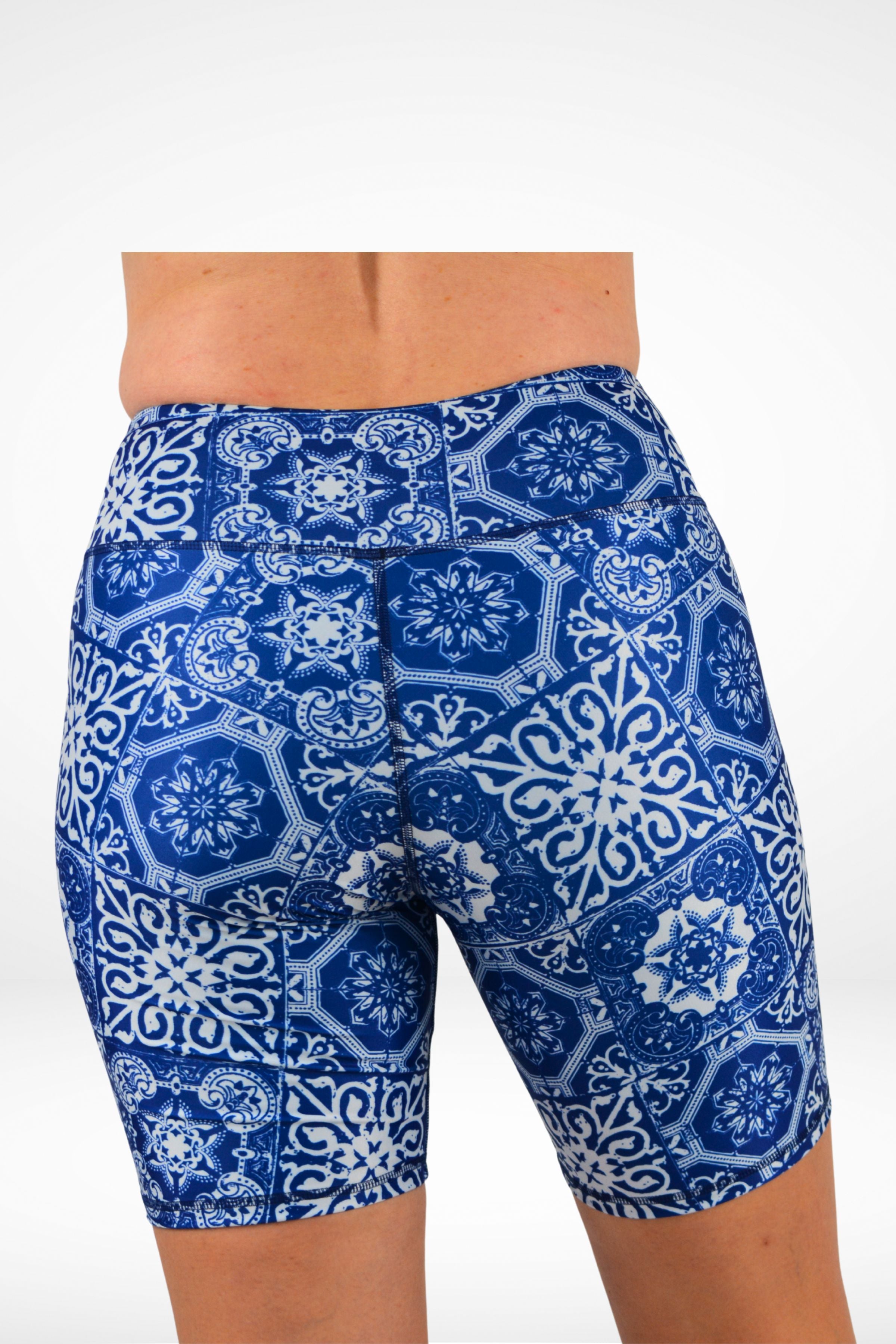 Blue and white patterned shorts on a white background