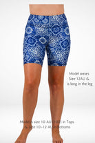 Blue patterned shorts worn by a model on a white background