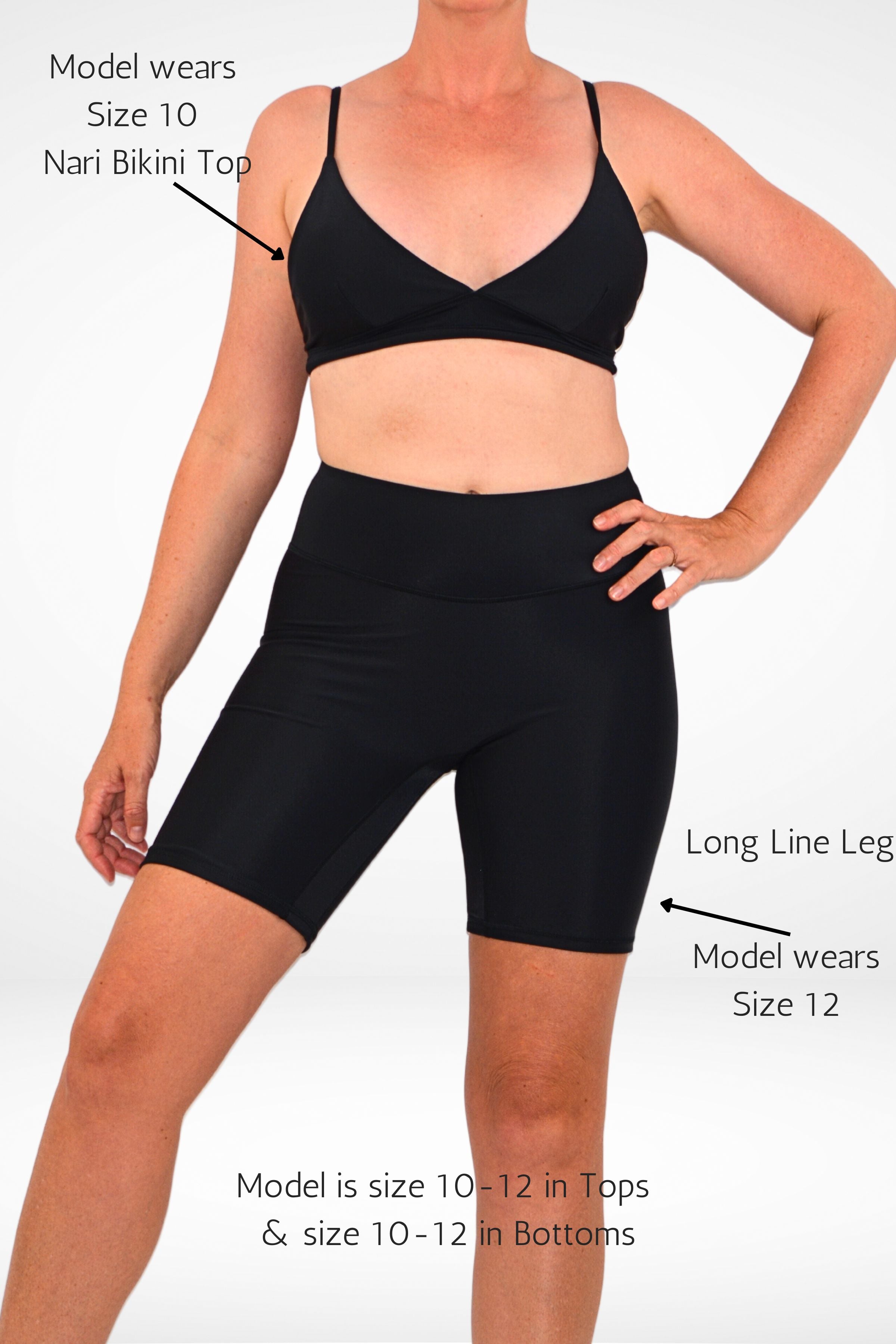 model wearing andavi black long line swim active compression bike shorts with black triangle bikini top