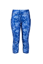 Blue capri pants with white floral pattern on a white background