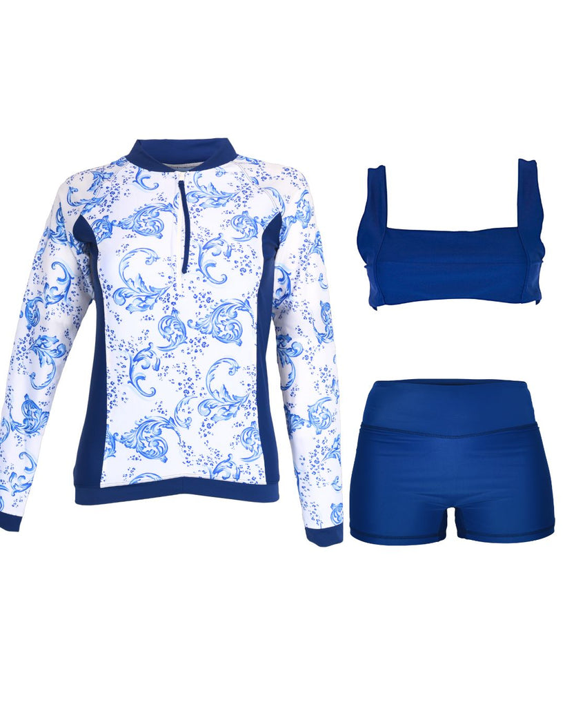 white and blue rash guard with navy blue swim shorts and bikini top