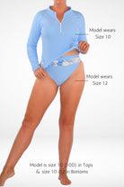 women wearing adnavi rash guard bundle in light blue with size guides