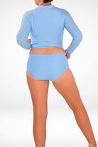 women wearing andavi full coverage light blue bikini bottom and long sleeve light blue swim top