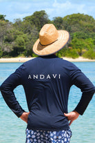 man wearing andavi long sleeve rash guard in navy blue