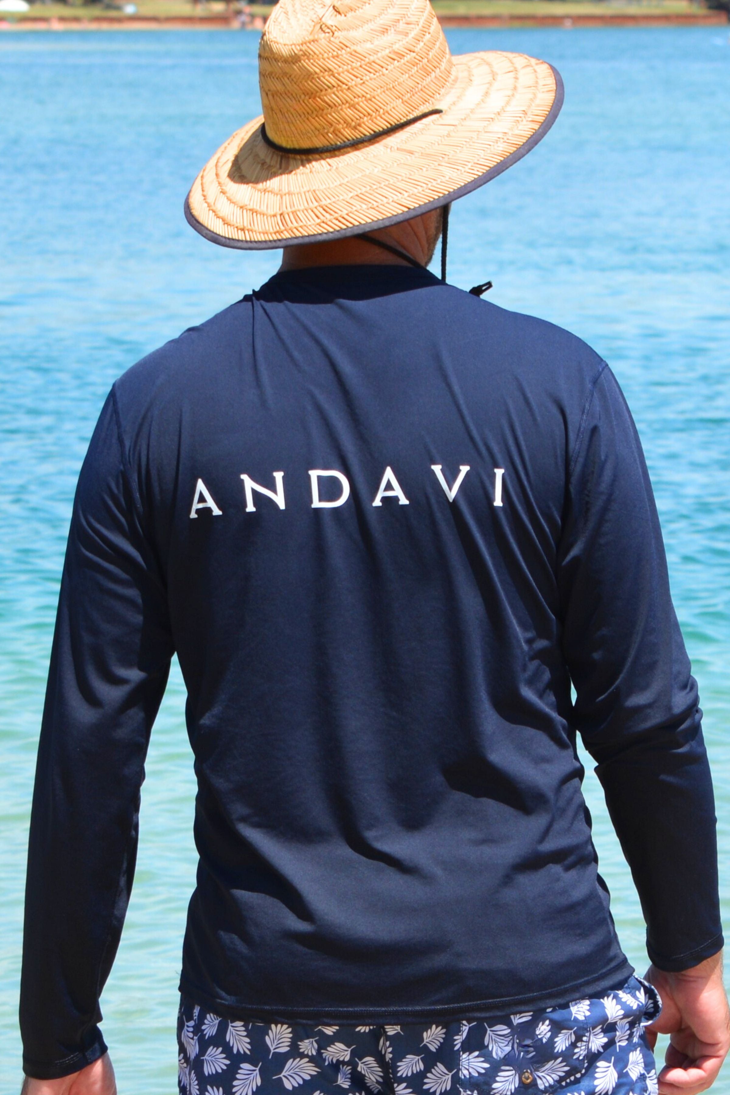 man wearing andavi mens rash guard with long sleeve in navy blue