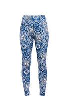 Blue patterned swim leggings on a white background
