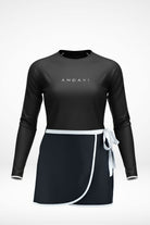 andavi black rash guard and matching black and white wrap swim skirt