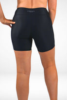 Black athletic shorts with a brand logo on a white background