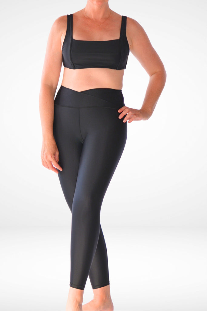 women wearing andavi black swim leggings with black matching square neck bikini top