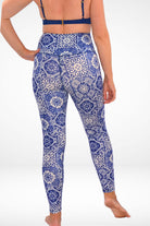 women wearing white and blue tile print mosaic swim leggings upf50+