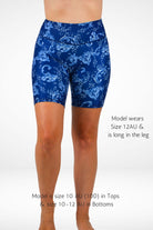 Blue patterned shorts worn by a model on a white background