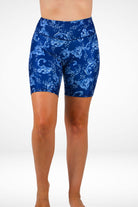 Blue patterned shorts worn by a person on a white background