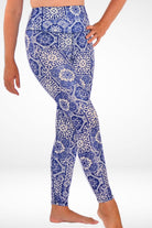 women wearing white and blue tile print swim leggings