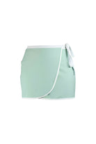 light green wrap swim skirt with white trim