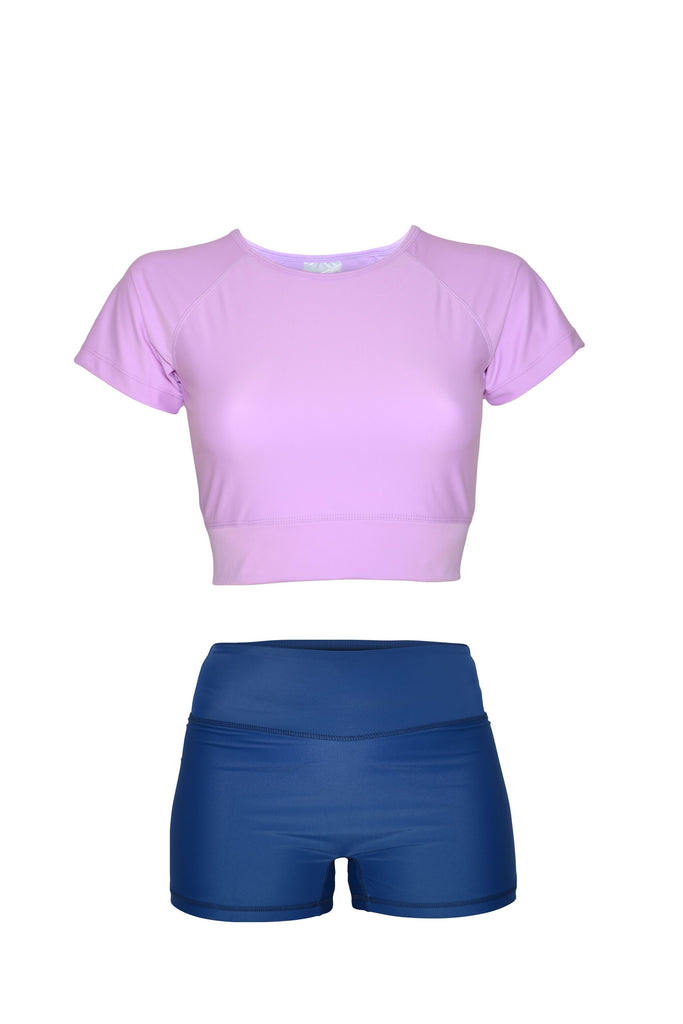 lilac short sleeve crop top and dark navy blue swim shorts
