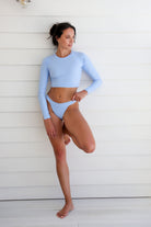 woman in light blue long sleeve swimwear